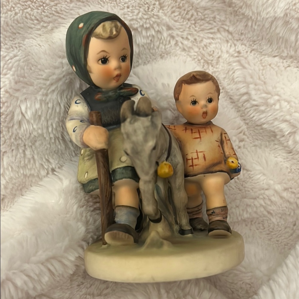 Charming Figurine with Children and Donkey